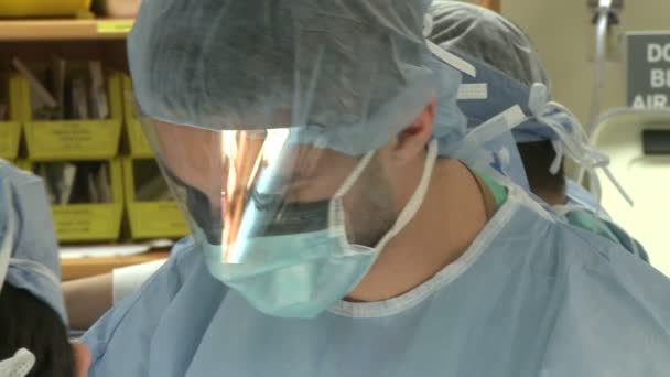 Surgeons performing medical tasks — Stock Video