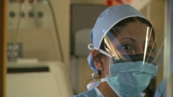 Surgeons performing medical tasks — Stock Video