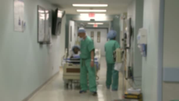 Hospital staff moving through  a typical hallway — Stock Video