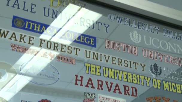 Glass window with names of potential colleges  (2 of 3) — Stock Video