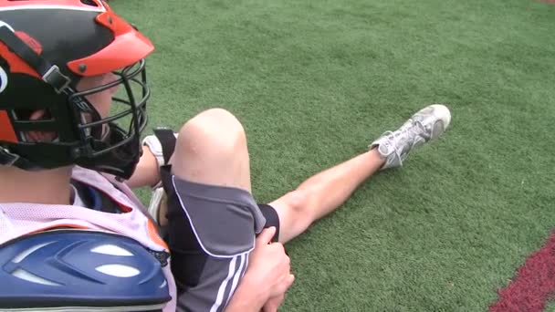 Boys Lacrosse players sitting on the field(1 of3) — Stock Video