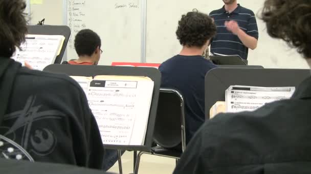 Music teacher instructing class — Stock Video