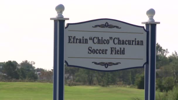 Enfrain "Chico" Chacurian Soccer Field sign — Stock Video