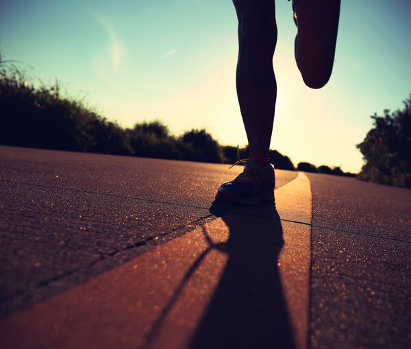 fitness woman running on road