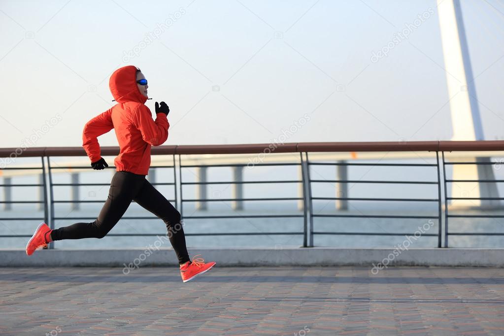 fitness woman running at seaside