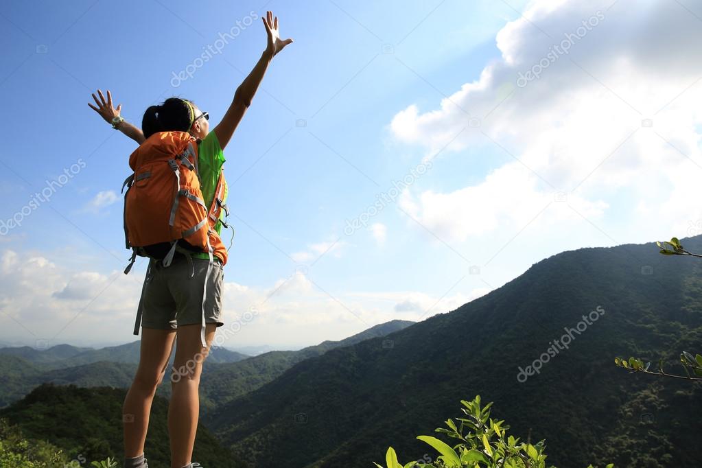 woman hiker with open arms