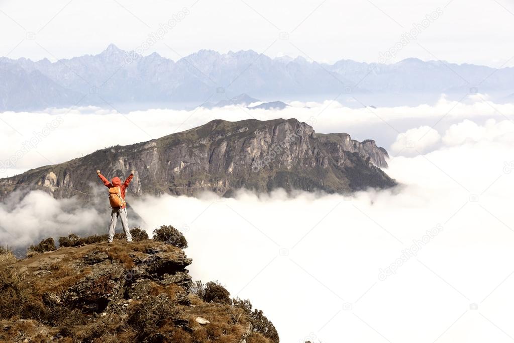 woman hiker with open arms