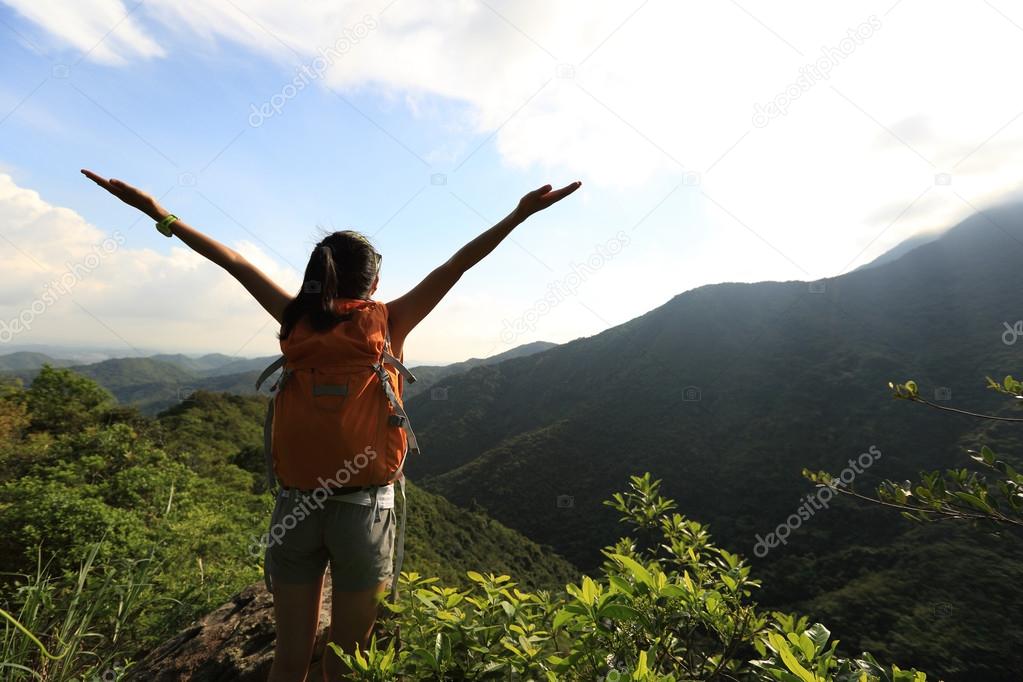 woman hiker with open arms