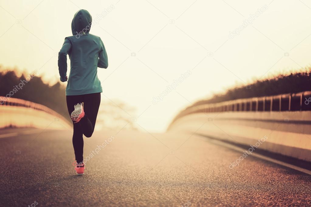 woman running at road