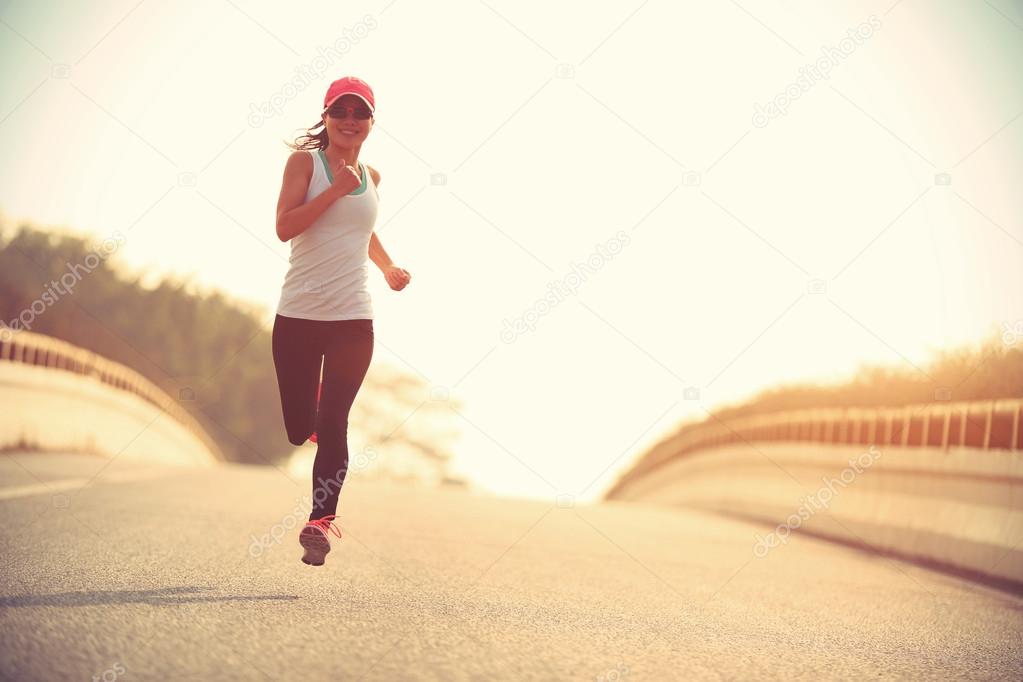 woman running at road