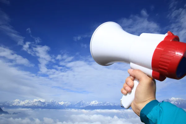 Woman shouting with loudspeaker — Stock Photo, Image