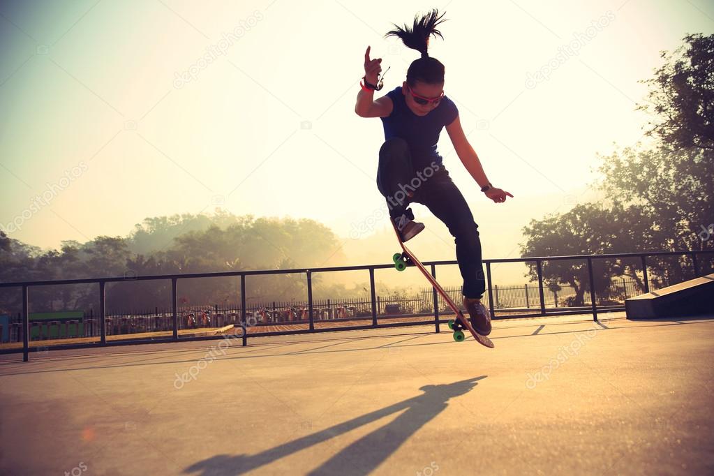 Skateboarder skateboarding at park Stock Photo by ©lzf 102866996