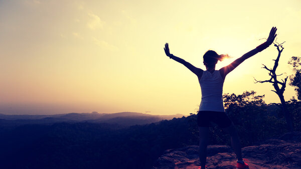 successful woman with open arms 