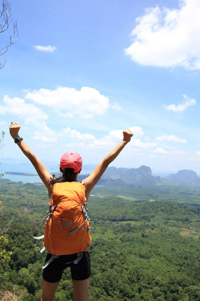 Cheering young woman with open arms — Stock Photo, Image