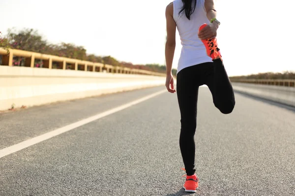 Woman runner stretching — Stock Photo, Image