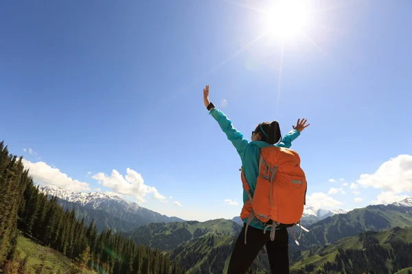 Cheering successful woman backpacker — Stock Photo, Image