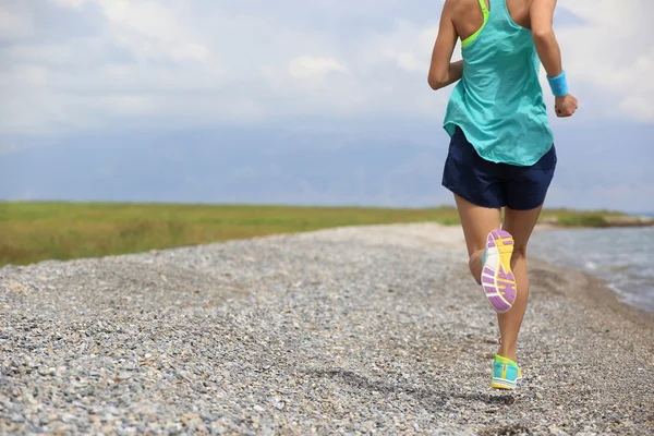 Woman running on road — Stock Photo, Image