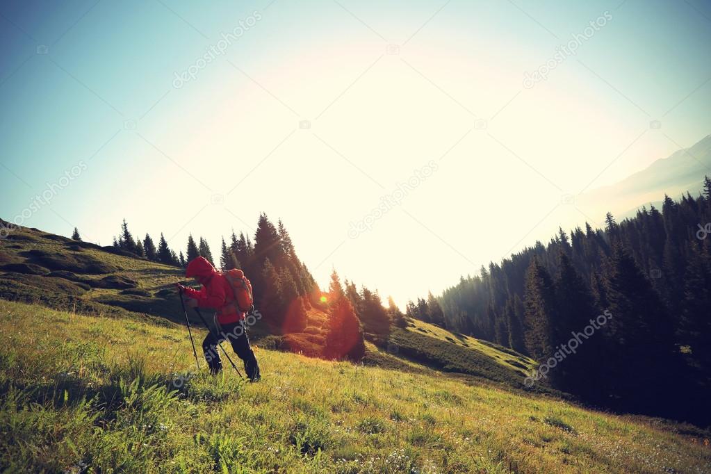 backpacker hiking on mountain  