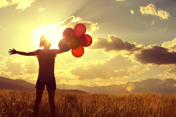 Woman with colored balloons — Stock Photo, Image