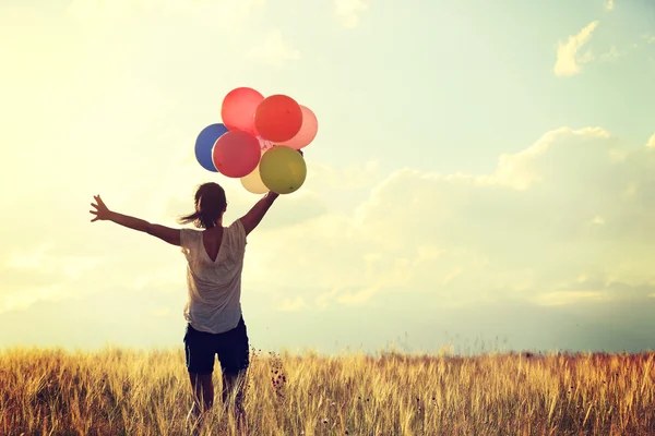 Mujer con globos de colores — Foto de Stock