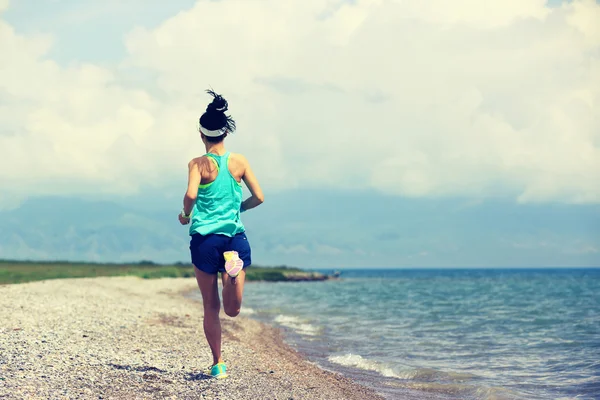 Woman running on road — Stock Photo, Image