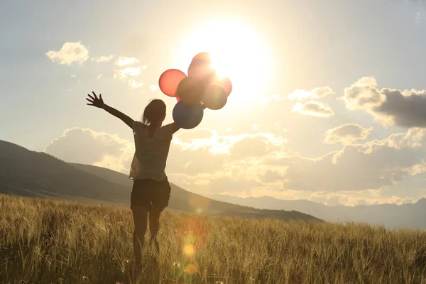 Woman with colored balloons — Stock Photo, Image