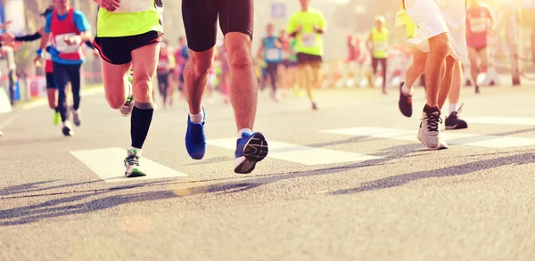 Unidentified marathon athletes legs running — Stock Photo, Image