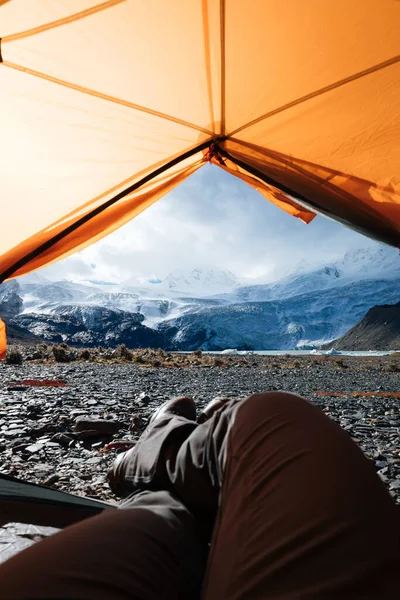 Hiker enjoy the beautiful landscape in tent