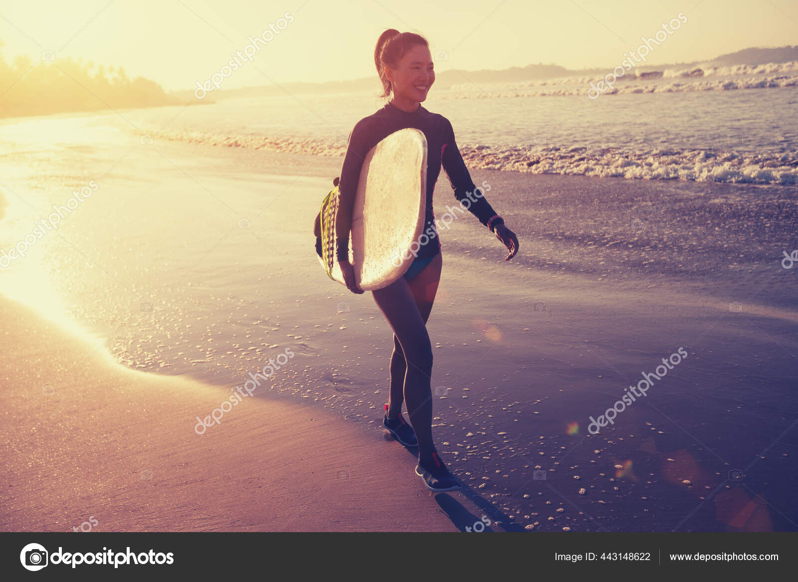 Female Surfer Walking Surfboard Beach Sunrise Stock Photo by ©lzf 443148622