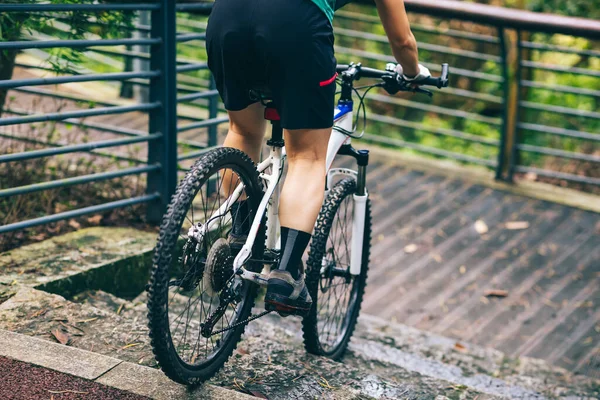 Woman freerider riding down stairs. Sports extreme and active lifestyle