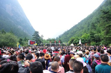 Tons of tourst queueing at the entrance of jiuzhaigou national park,china clipart