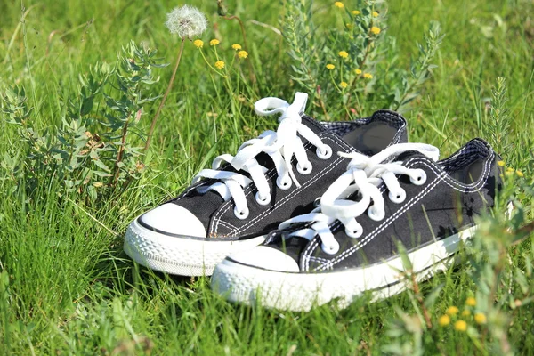 Leisure shoes on green grass — Stock Photo, Image