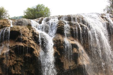 Waterfall at jiuzhaigou national park in china clipart
