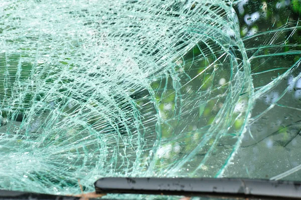 Broken windshield of car by typhoon — Stock Photo, Image