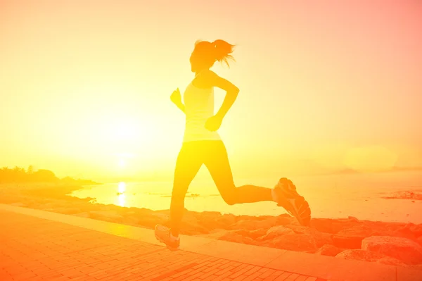 Runner athlete running at seaside. woman fitness silhouette sunrise jogging workout wellness concept. — Stock Photo, Image