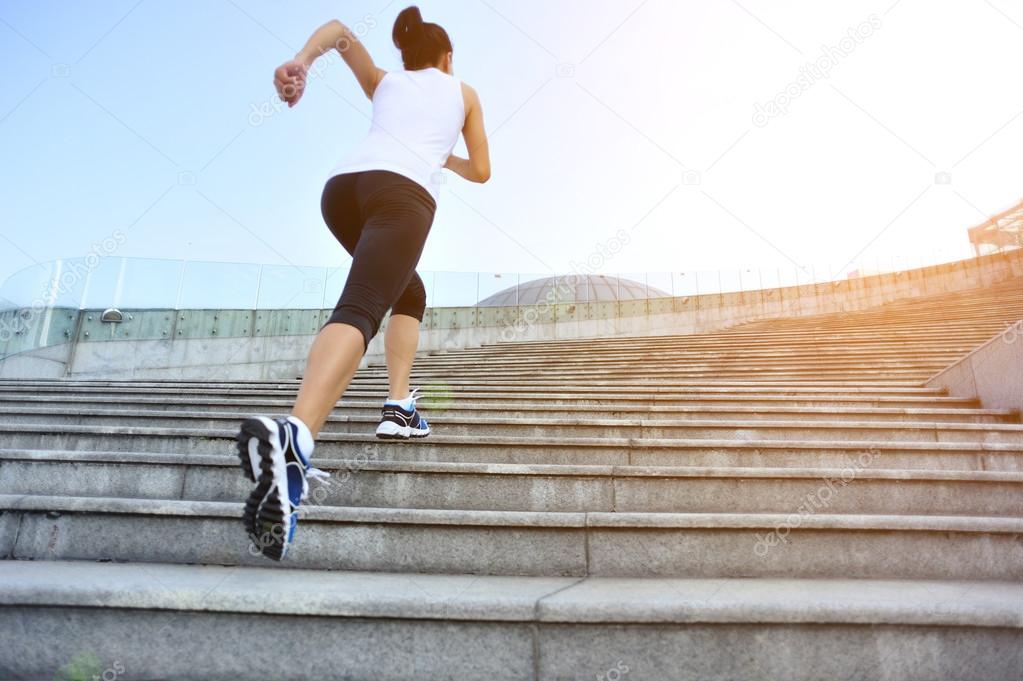 Runner athlete running on stairs.