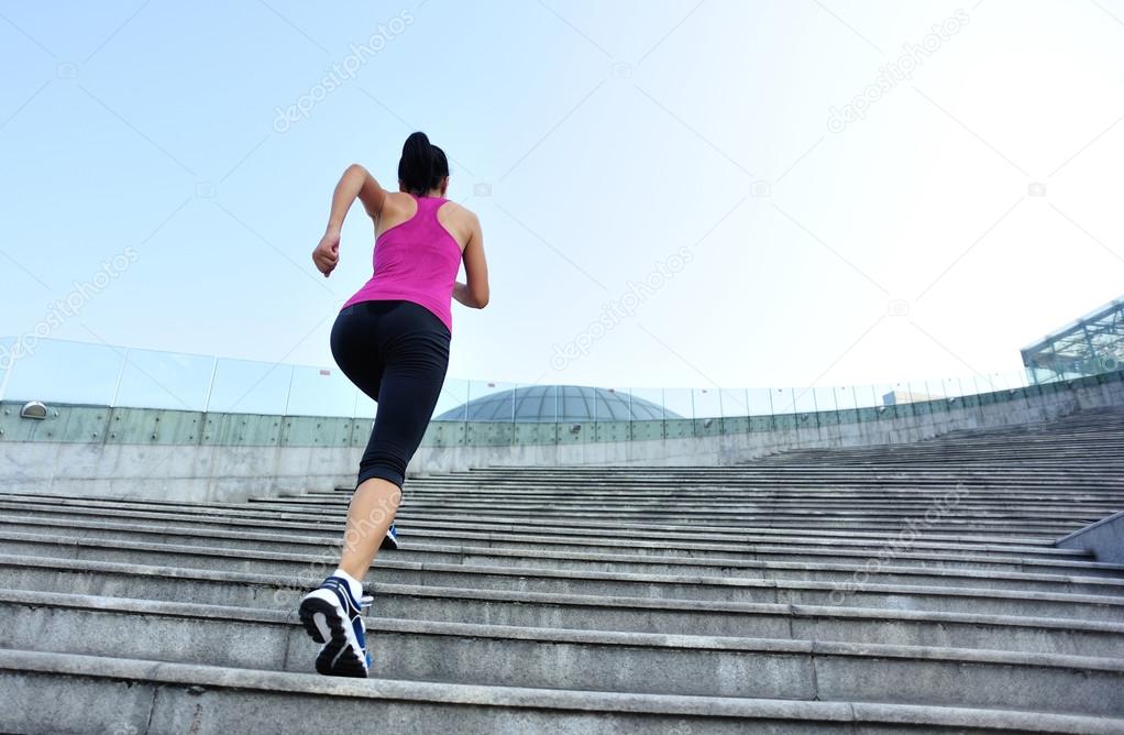 Runner athlete running on stairs.