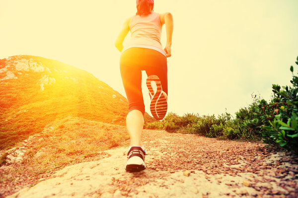 Young woman running on seaside