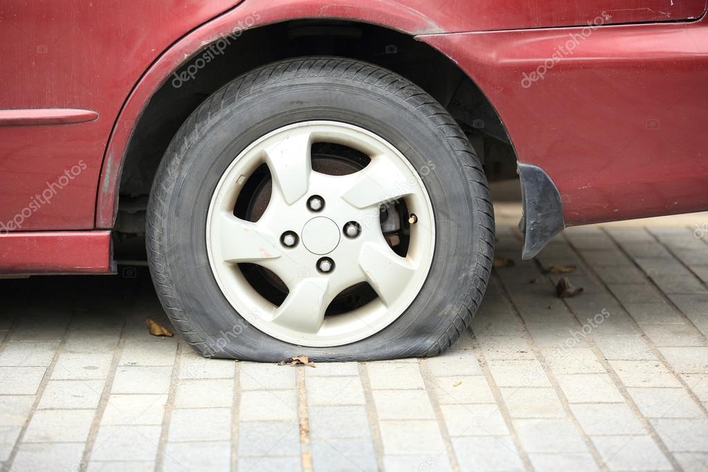 Flat tire on car wheel