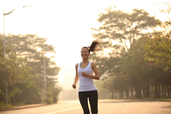 Young fitness woman runner running outdoor — Stock Photo, Image