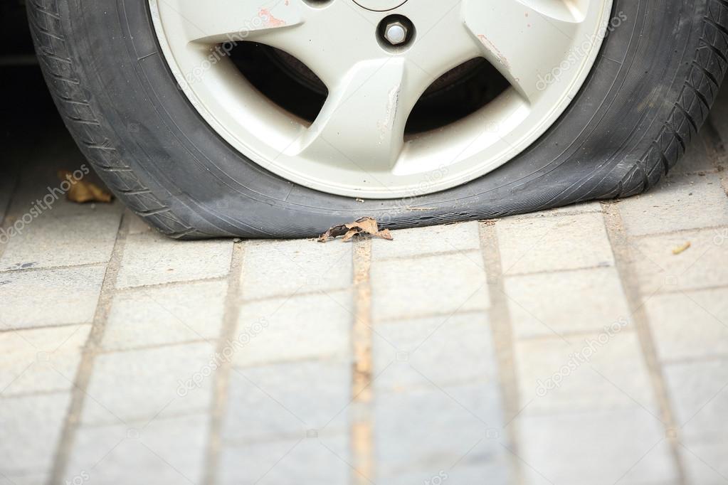 Flat tire on car wheel