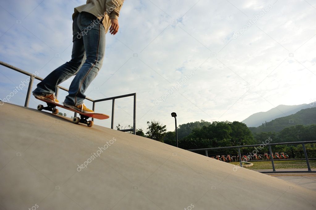 Woman legs skateboarding