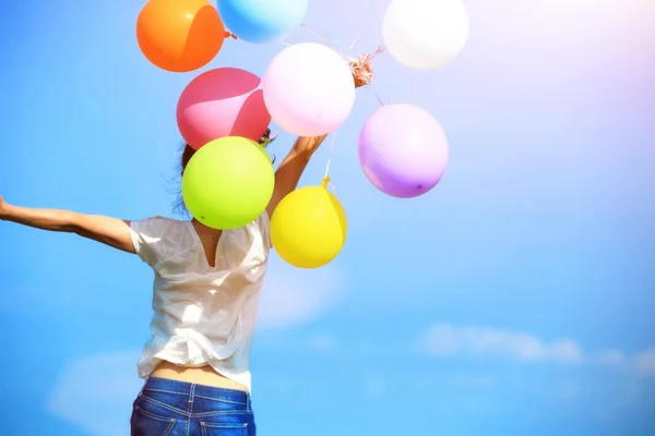 Woman with colored balloons — Stock Photo, Image