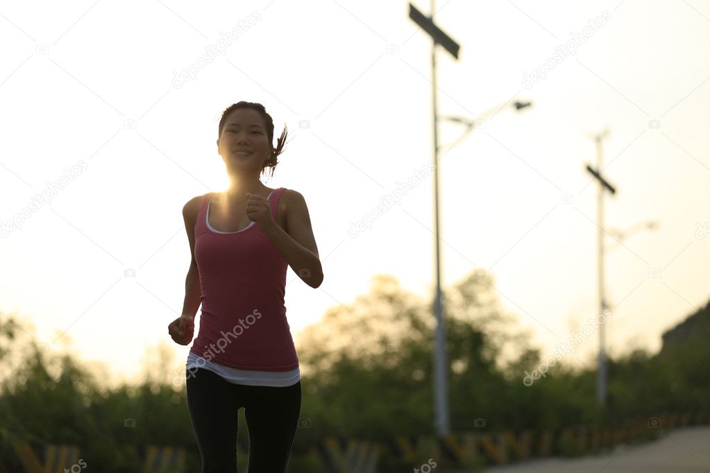 Young fitness woman jogging