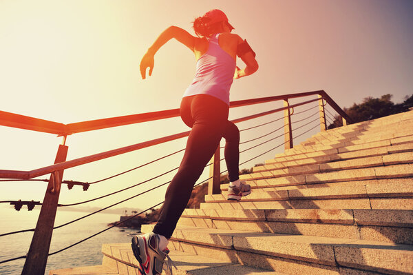 Runner athlete running up stairs