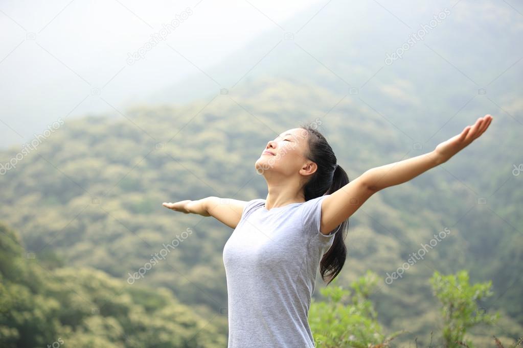 Happy woman with open arms