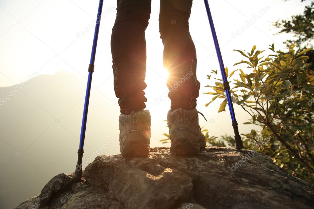 Female hiker legs on mountain