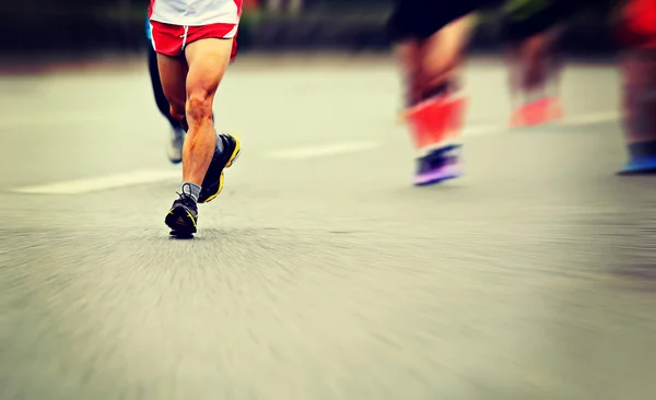 Male athletes running — Stock Photo, Image