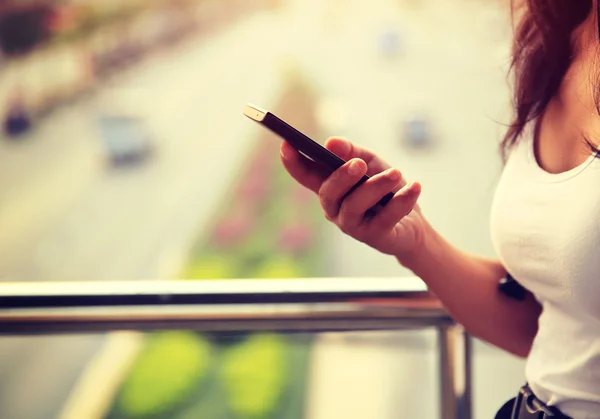 Female hands using smartphone — Stock Photo, Image