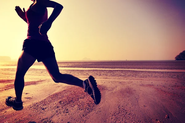 Female running silhouette at beach — Stock Photo, Image